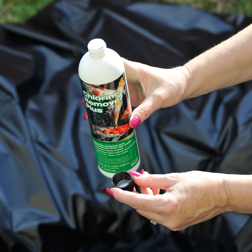 Pouring water treatments into a water feature