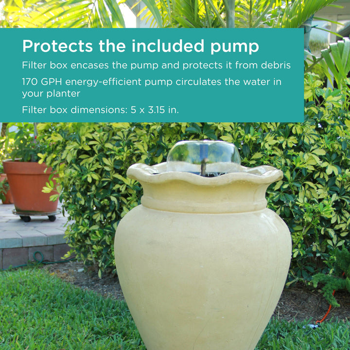A backyard with a container Fountain in a tall white vase 