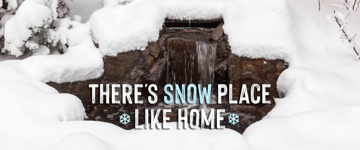 Waterfall and pond covered in snow, there's snow place like home
