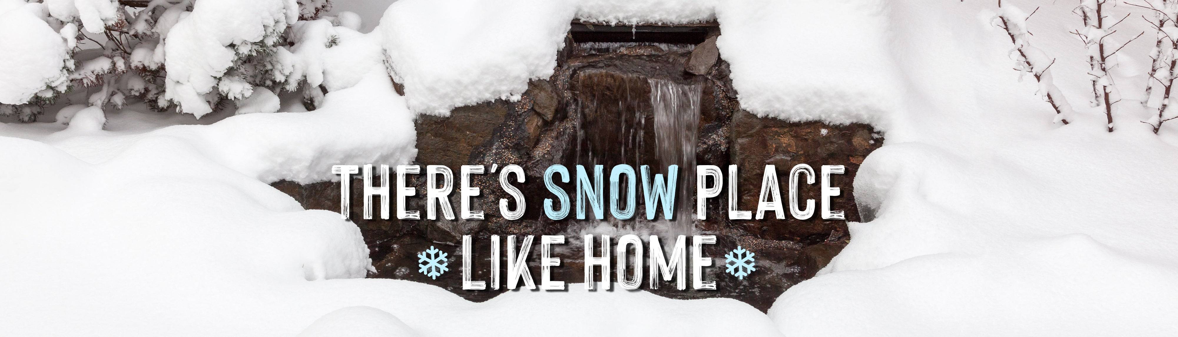 Waterfall and pond covered in snow, there's snow place like home